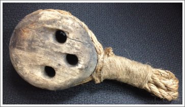 A wooden deadeye and rope from the rigging of the J.W. Bridgeman